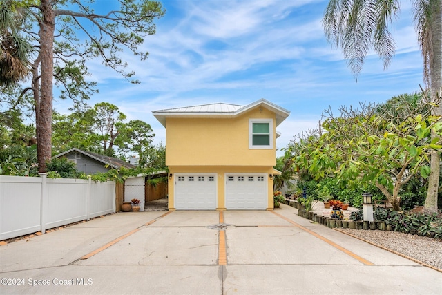 view of property exterior featuring a garage