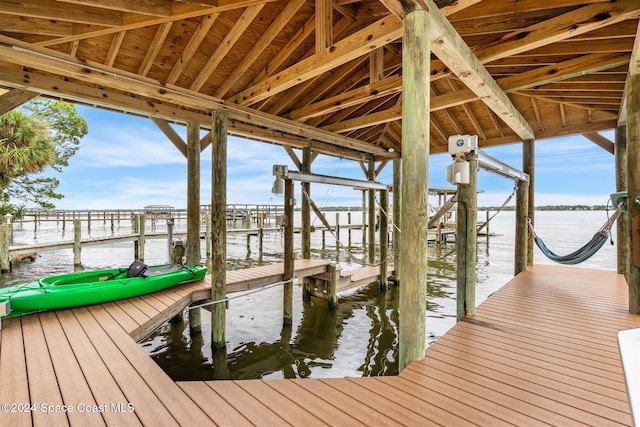 dock area with a water view