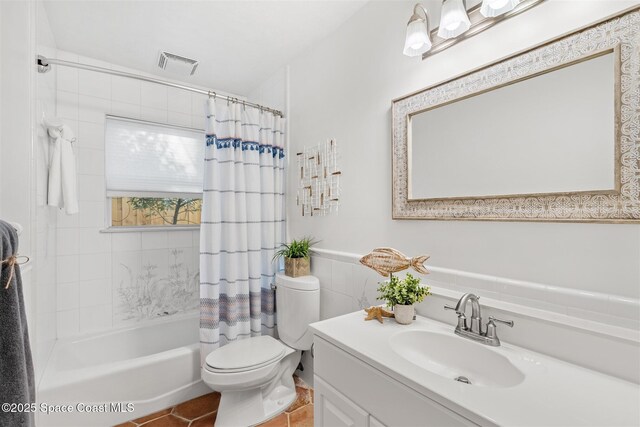 full bathroom with tile patterned floors, vanity, toilet, and shower / bathtub combination with curtain