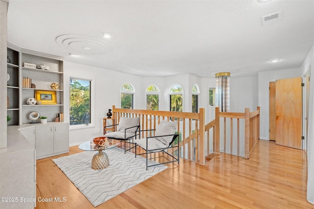 sitting room with light hardwood / wood-style flooring