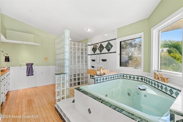 bathroom featuring vanity, wood-type flooring, and independent shower and bath