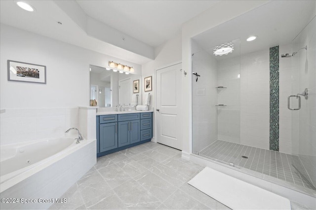 bathroom with separate shower and tub and vanity