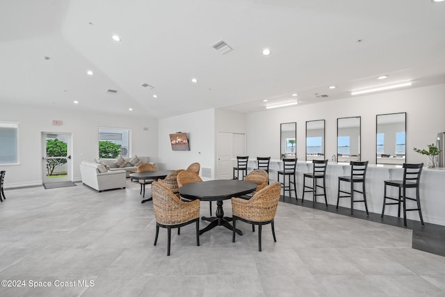 dining area with lofted ceiling