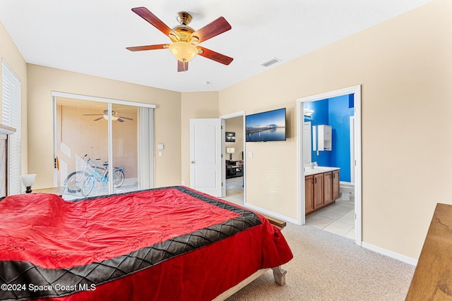 carpeted bedroom featuring ensuite bath and ceiling fan