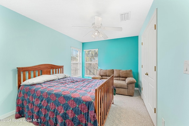 carpeted bedroom with ceiling fan