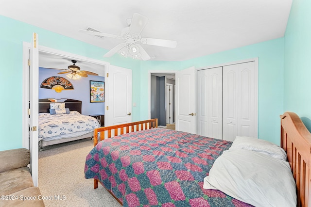 carpeted bedroom featuring ceiling fan and a closet