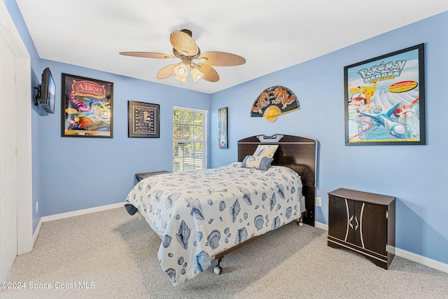 bedroom featuring ceiling fan and light colored carpet