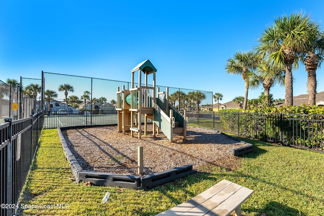 view of playground featuring a lawn