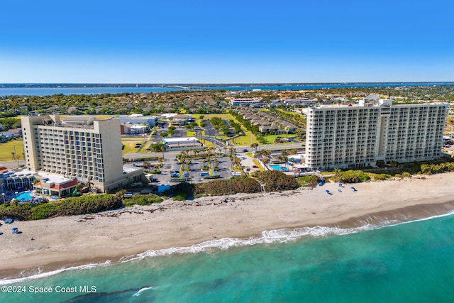 bird's eye view featuring a water view and a view of the beach