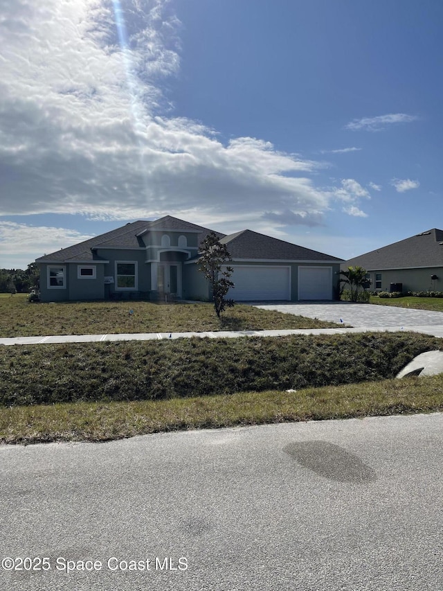 view of front of property with a garage