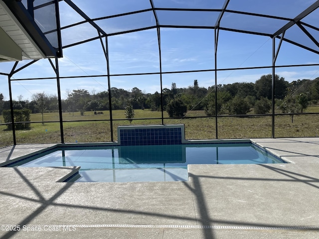 view of pool with a lanai and a patio