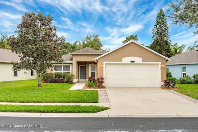 ranch-style home featuring a front lawn and a garage