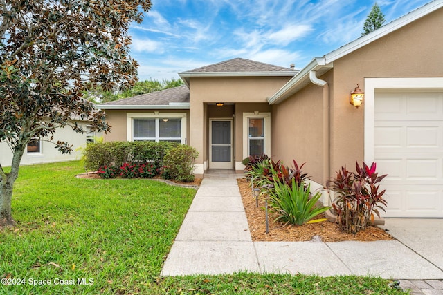 2122 Spring Creek Cir NE, Palm Bay, FL 32905 - entrance to property with stucco siding, a lawn, a garage, and roof with shingles