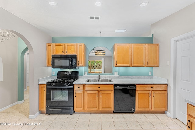 2122 Spring Creek Cir NE, Palm Bay, FL 32905 - kitchen with black appliances, a sink, arched walkways, light countertops, and light tile patterned floors