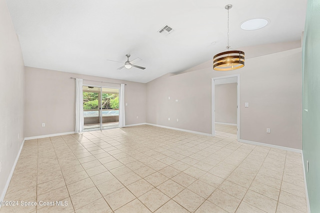 spare room featuring light tile patterned floors, lofted ceiling, and ceiling fan with notable chandelier