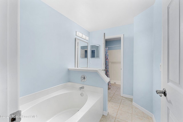2122 Spring Creek Cir NE, Palm Bay, FL 32905 - full bathroom featuring a garden tub, tile patterned floors, baseboards, and a shower with shower curtain
