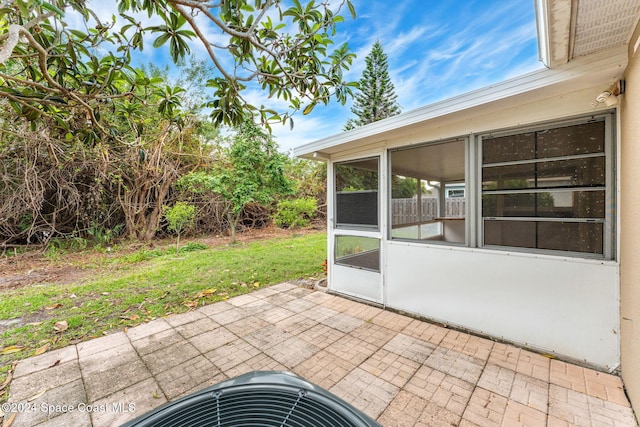 view of patio / terrace featuring a sunroom