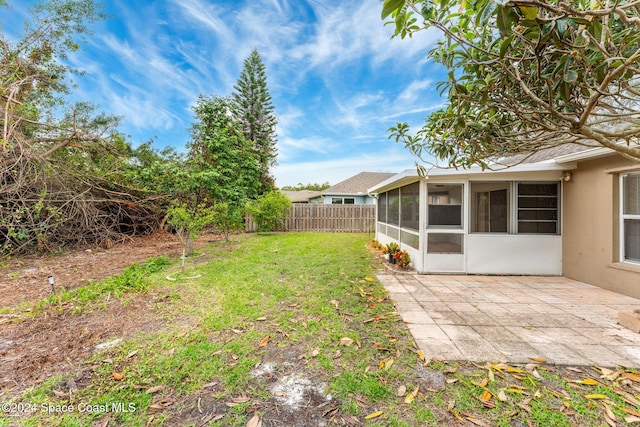 view of yard with a patio area and a sunroom