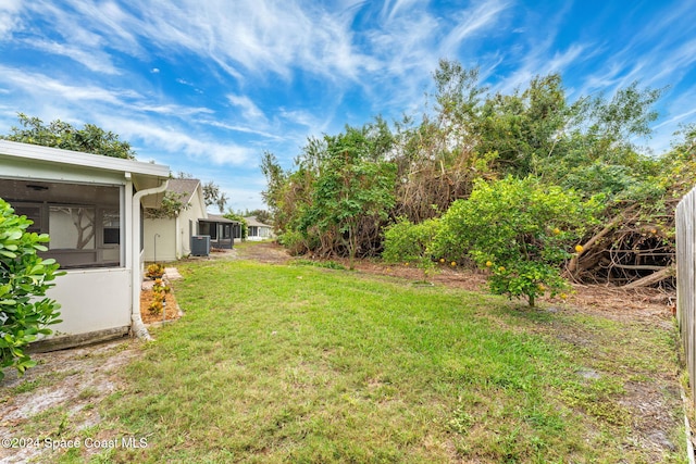 2122 Spring Creek Cir NE, Palm Bay, FL 32905 - view of green lawn featuring cooling unit