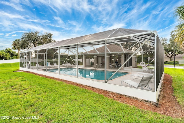 2122 Spring Creek Cir NE, Palm Bay, FL 32905 - swimming pool with a patio area, a yard, and a lanai