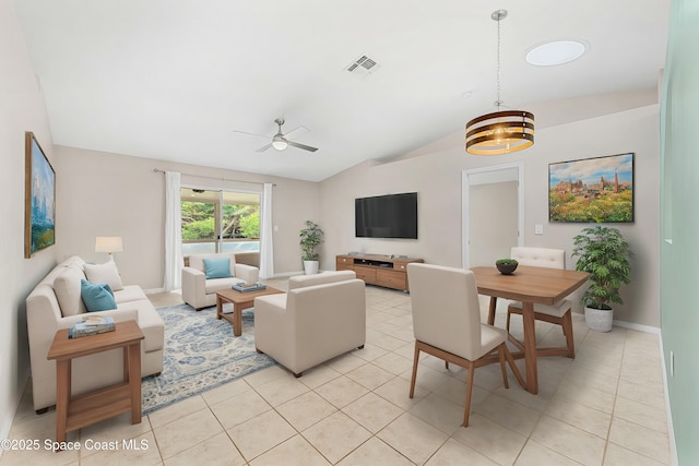 living room featuring light tile patterned floors, lofted ceiling, and ceiling fan with notable chandelier