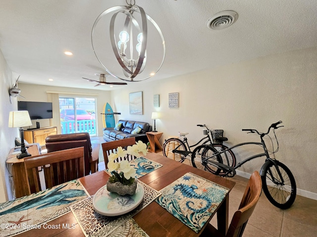 dining area featuring hardwood / wood-style floors and a chandelier