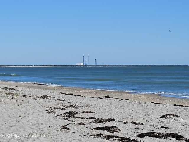 property view of water featuring a beach view