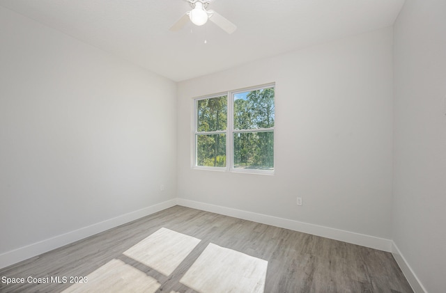 unfurnished room featuring ceiling fan and light hardwood / wood-style floors