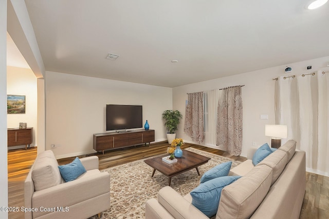 living room with wood-type flooring