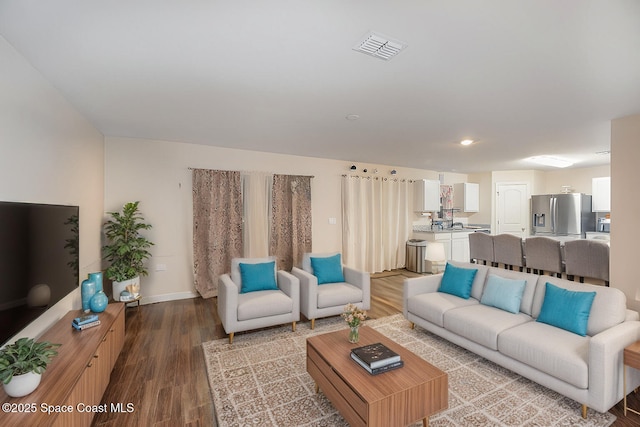 living room with wood-type flooring