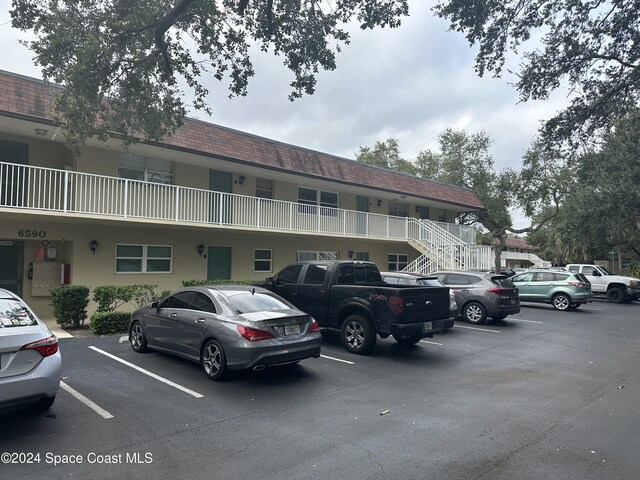 6590 Odyssey St Unit I, Cape Canaveral, FL 32920 - view of uncovered parking lot