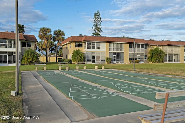 6590 Odyssey St Unit I, Cape Canaveral, FL 32920 - view of community featuring a lawn and shuffleboard