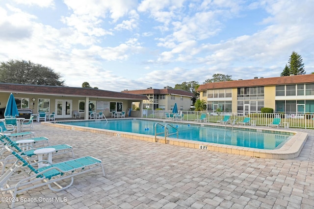 view of swimming pool with a patio area