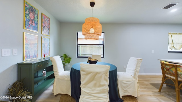 dining space featuring hardwood / wood-style floors