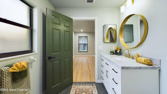 bathroom featuring tile patterned floors and vanity