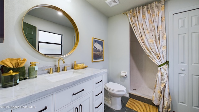 bathroom with tile patterned floors, vanity, toilet, and a shower