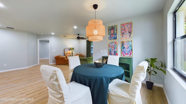 dining space featuring light hardwood / wood-style floors and ceiling fan