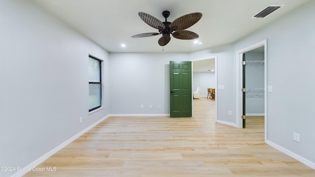 unfurnished room with ceiling fan and light hardwood / wood-style flooring