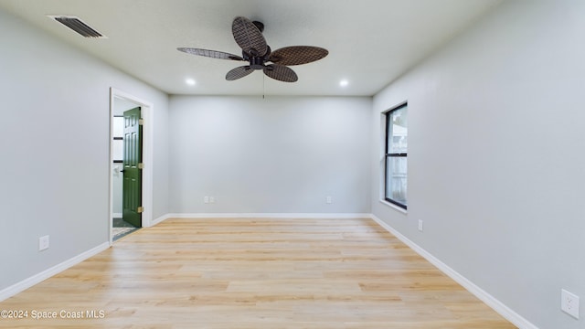 spare room with ceiling fan and light hardwood / wood-style floors