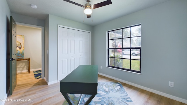 office space featuring hardwood / wood-style floors and ceiling fan