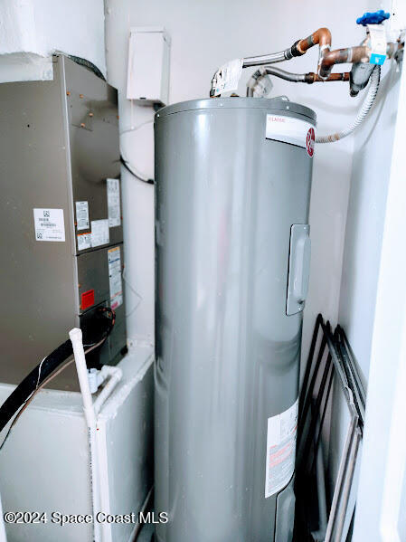 utility room with water heater