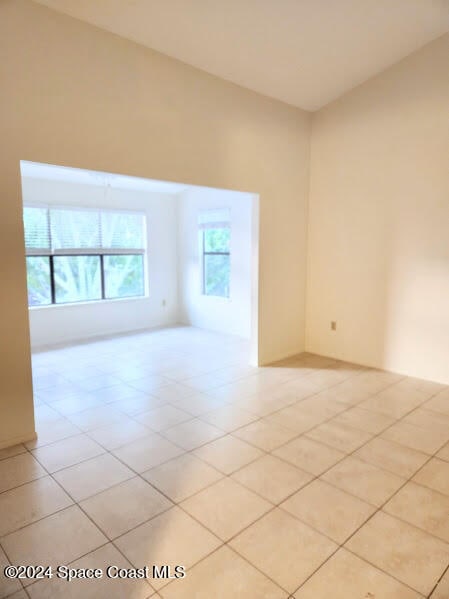 spare room featuring light tile patterned floors