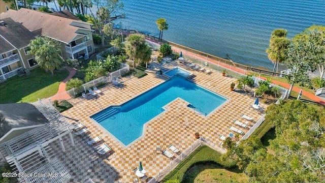 birds eye view of property with a water view