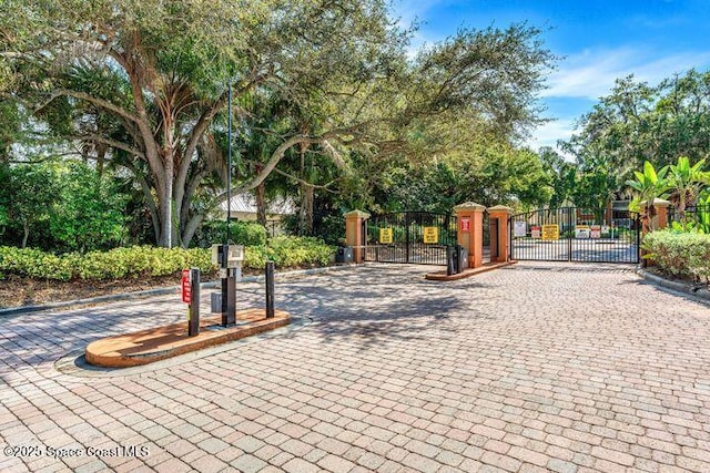 surrounding community featuring fence and a gate