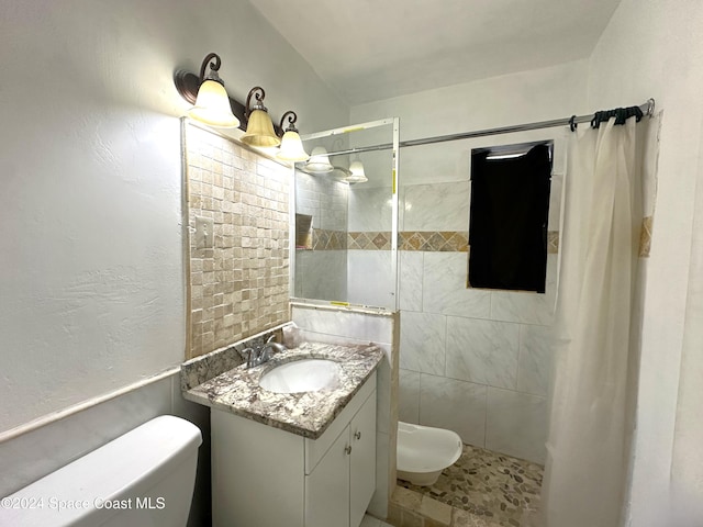 bathroom with vanity, a shower with shower curtain, and toilet