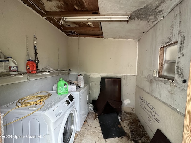 laundry area with washing machine and dryer