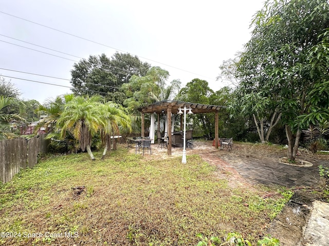 view of yard with a patio area and a pergola