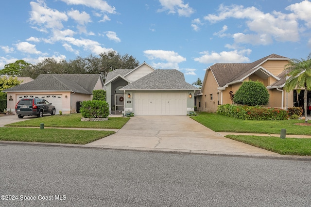 view of front facade with a front lawn and a garage