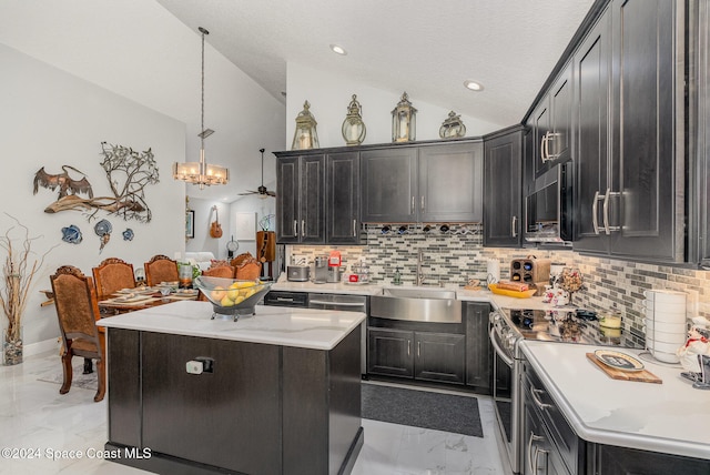 kitchen featuring stainless steel range with electric cooktop, backsplash, hanging light fixtures, and vaulted ceiling