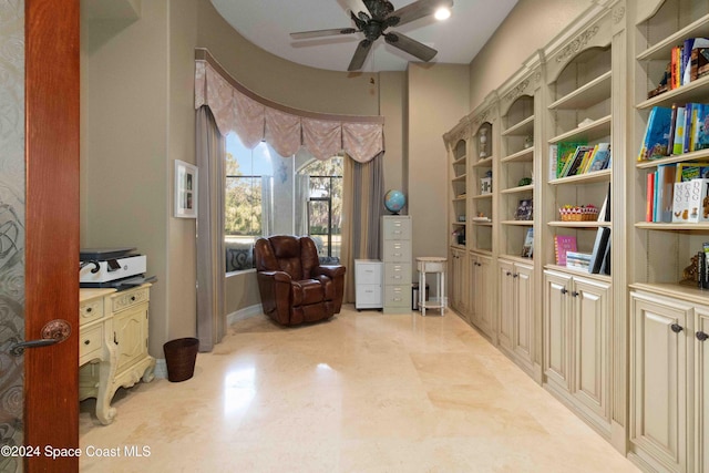 sitting room featuring ceiling fan